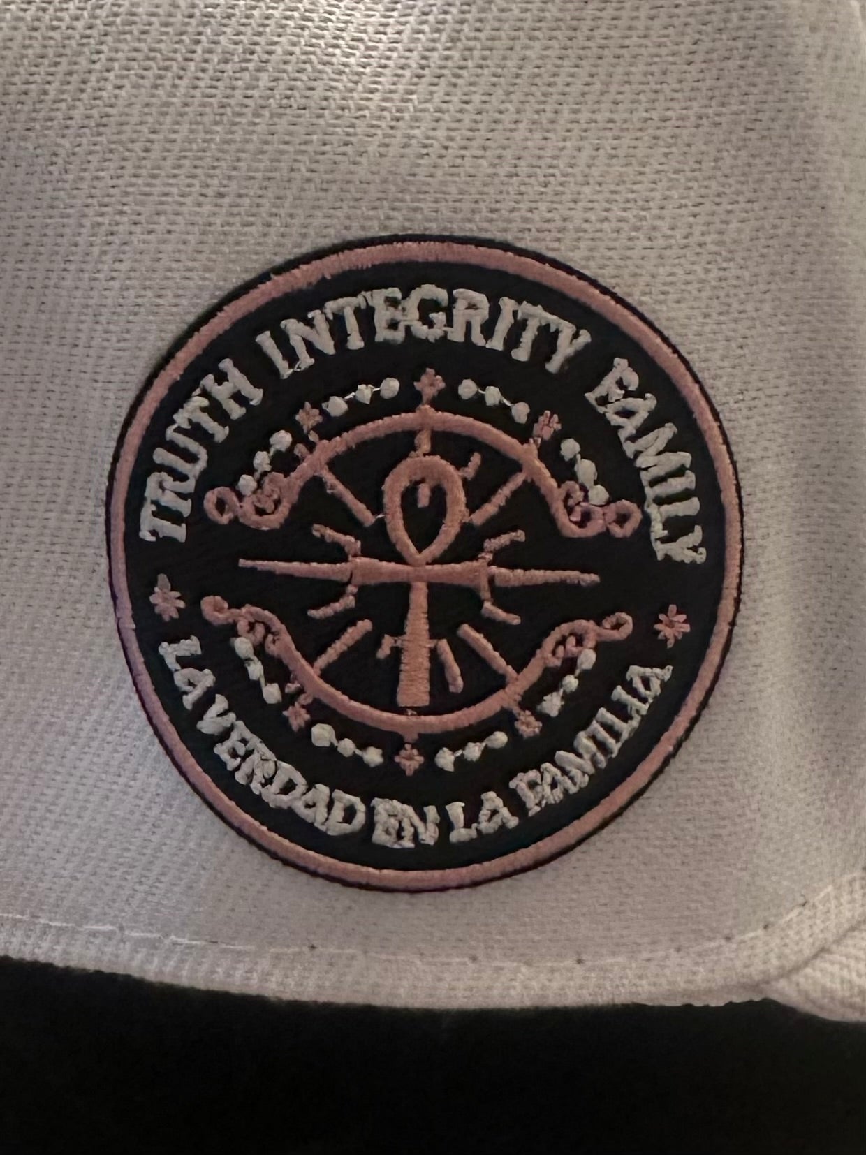 Rose gold logo wht hat